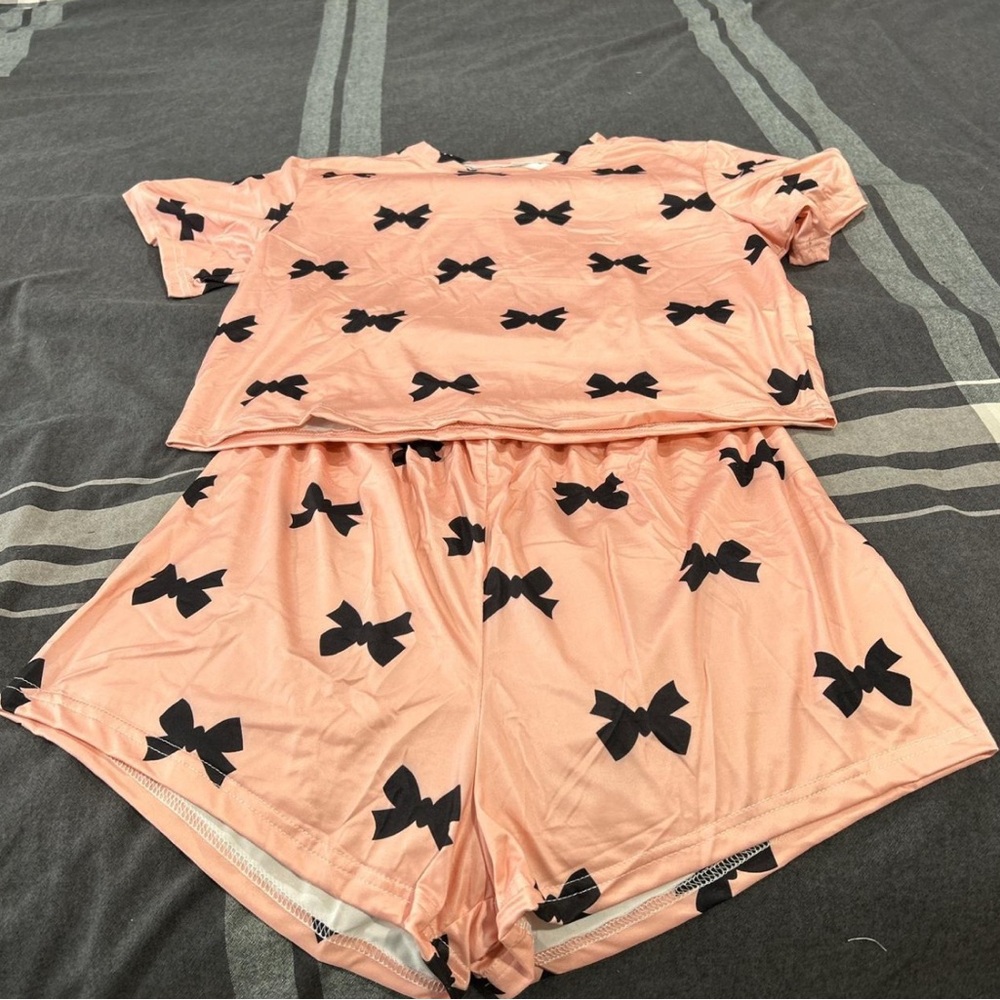 Pink and black bow print pajama set.
